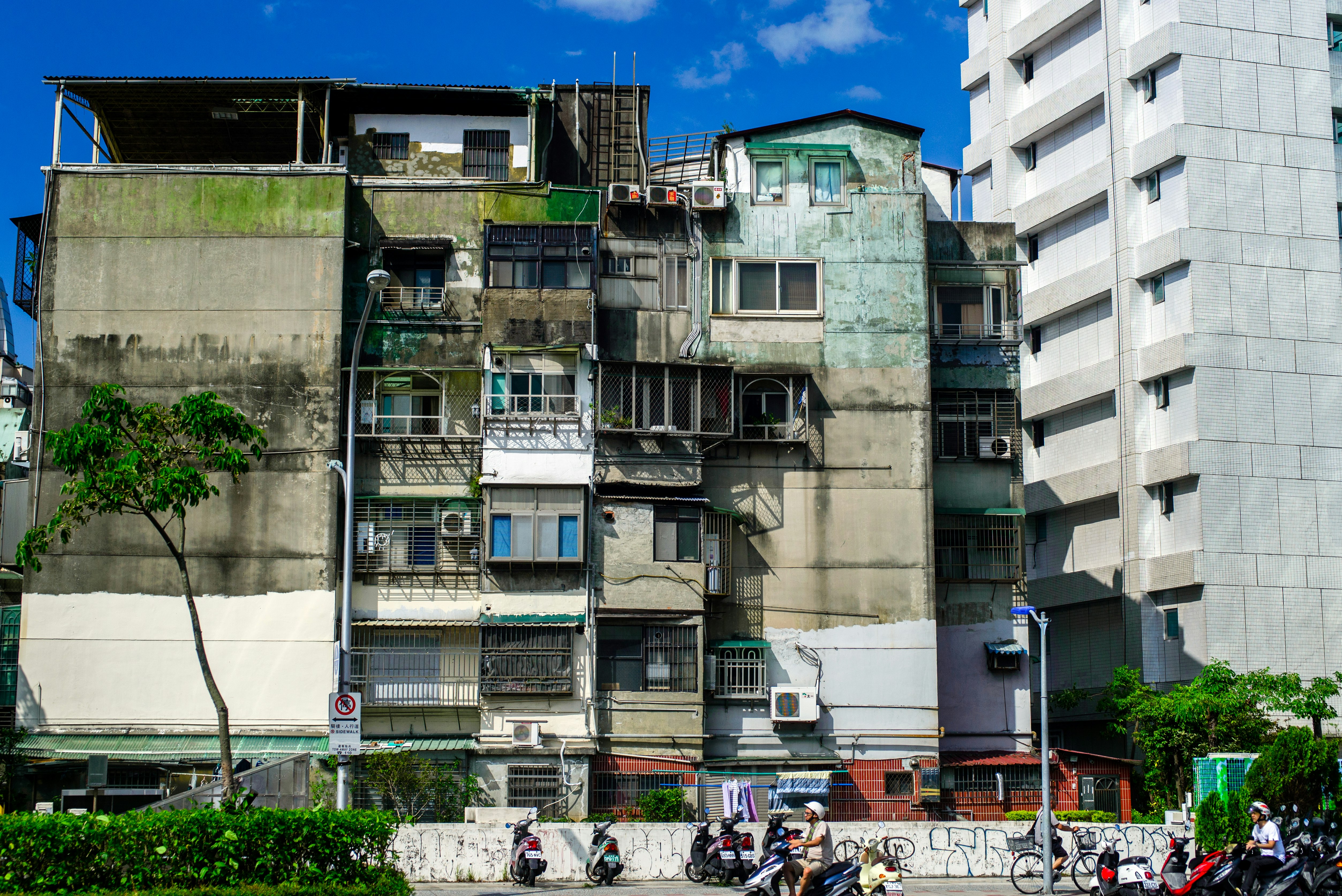 people walking near white concrete building during daytime